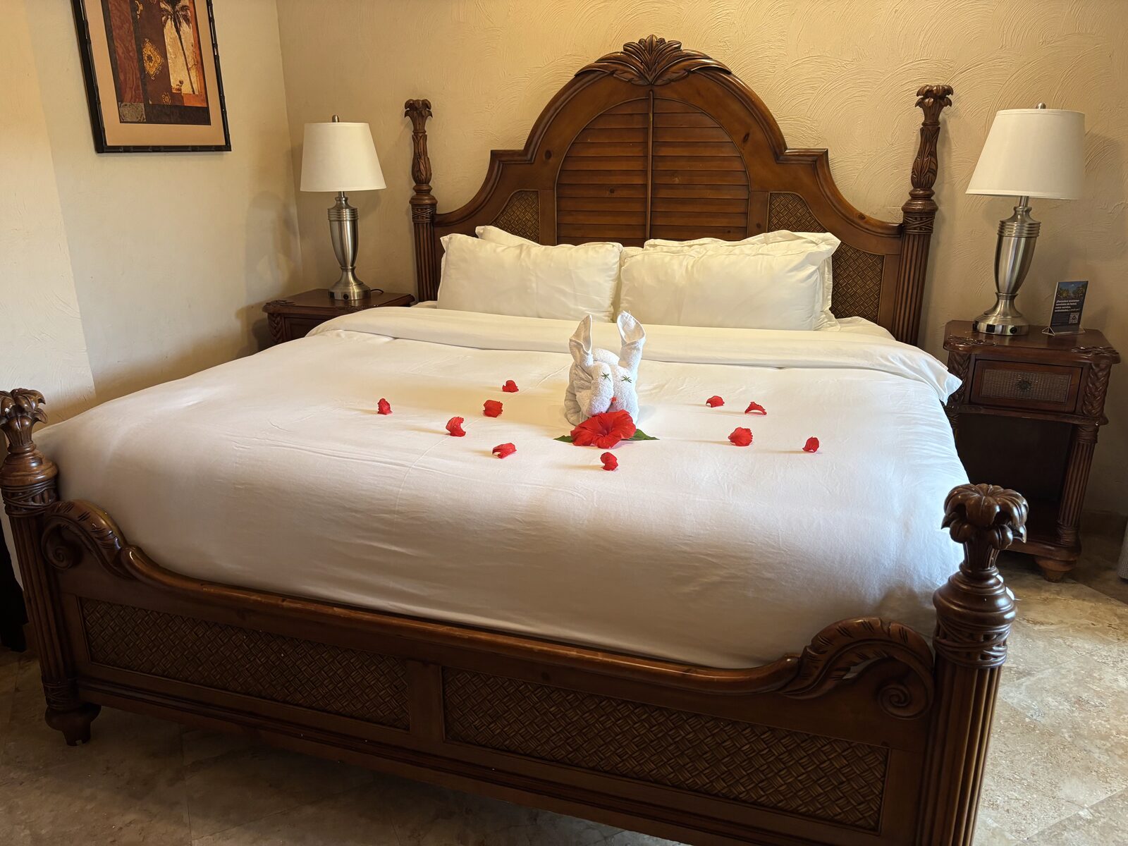 Master bedroom king bed with carved wood headboard