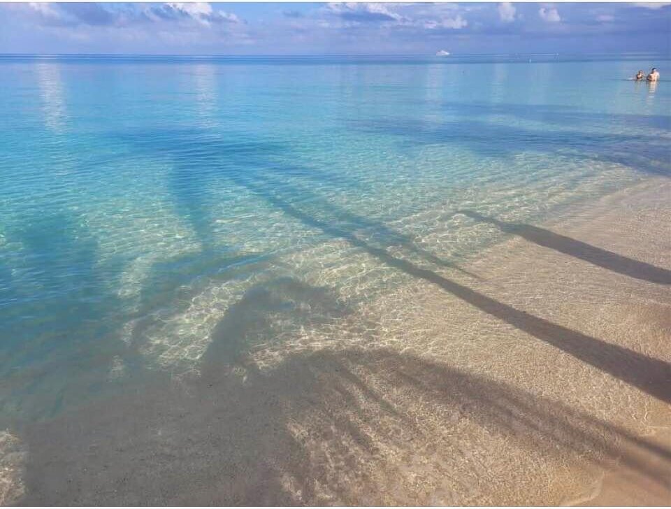 Crystal-clear turquoise water at West Bay Beach